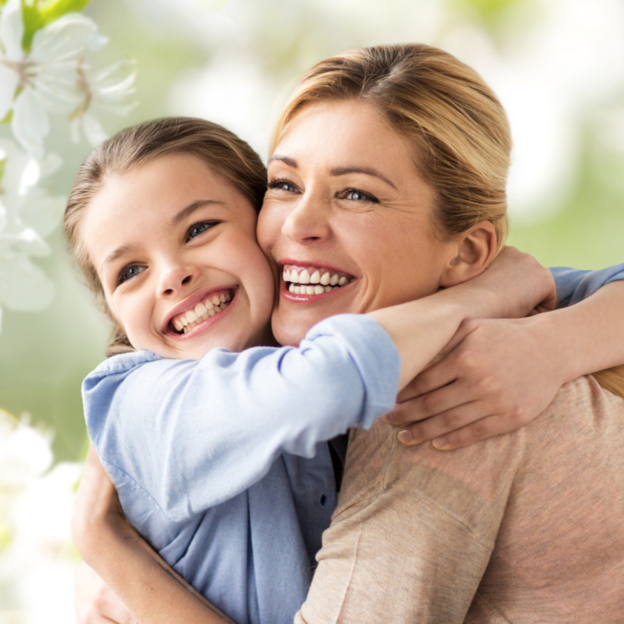 mother and daughter smiling