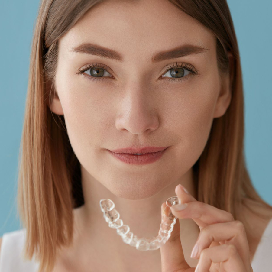 woman wearing invisalign aligners